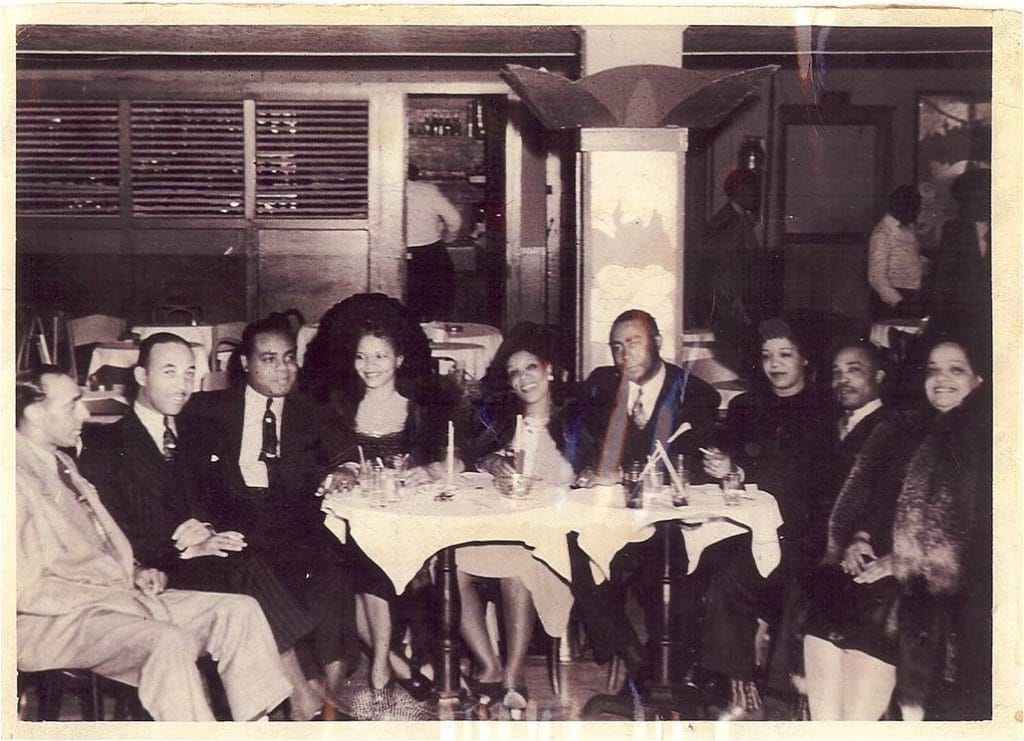 Grand opening of Wally's Paradise, founder Joseph Walcott seated second from right